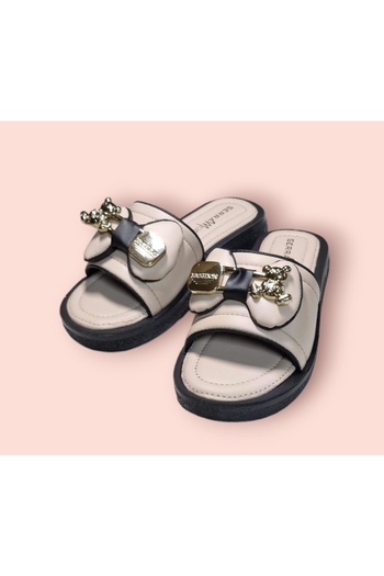 Serra Women's ribboned soft sole slipper with accessories.