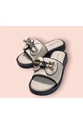 Serra Women's ribboned soft sole slipper with accessories.