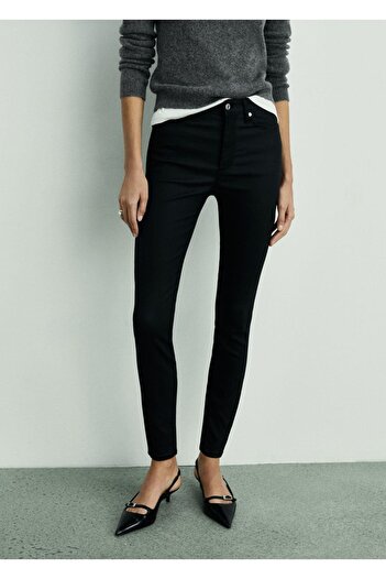 MANGO Woman Wax Mid-Rise Skinny Jeans