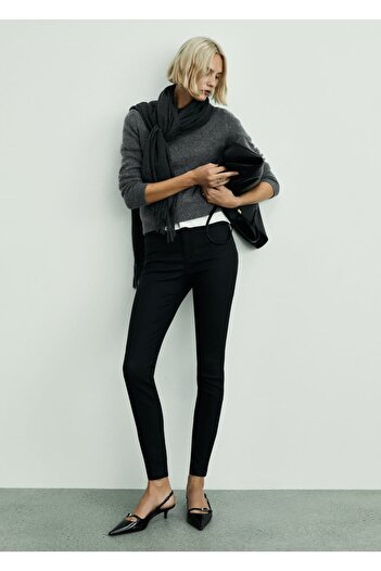 MANGO Woman Wax Mid-Rise Skinny Jeans