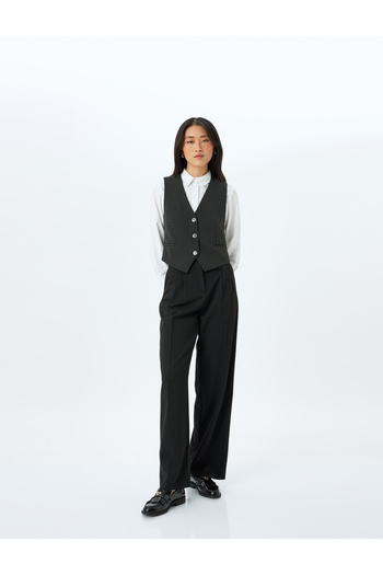 Koton Buttoned V-neck striped blazer vest.