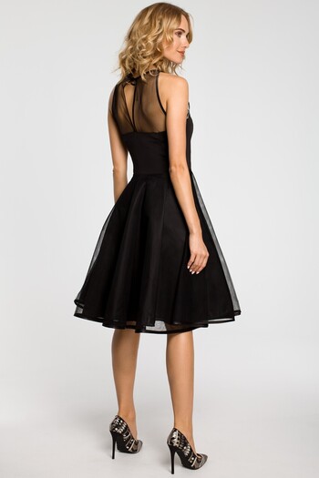 Made of Emotion An evening, knee-lenth dress with a mesh yoke