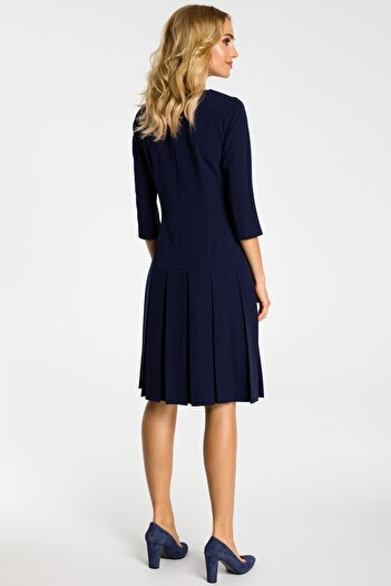 Made of Emotion Choose this short-sleeve drop waist dress with adorable pleats for a girlish elegant look.