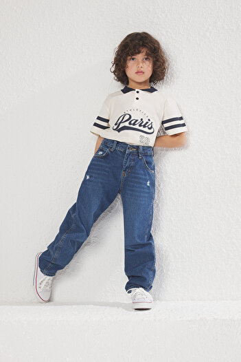 TRENDYOLKIDS بنطلون جينز واسع من القطن المرن للأولاد باللون الأزرق الداكن TKDSS24PL00005