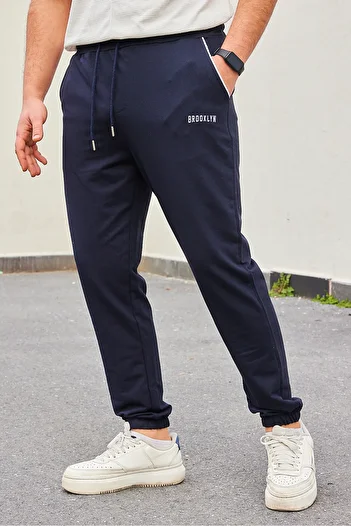 Trendyol Collection Μπλε Navy Regular Fit Sweatpants - Printed and Piping Rubber Leg TMNSS22EA0121