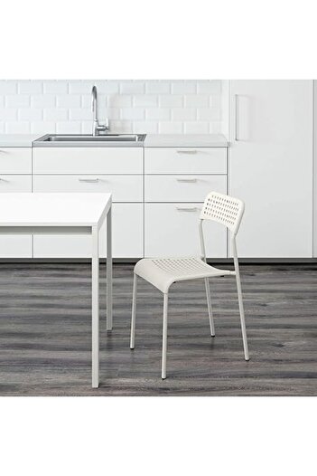 MAAS Versatile modern dining chair with simple and unique design, perfect for all types of home decor.