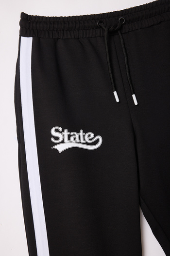 Trendyol Collection Black Printed Stripe Detailed Straight Leg Sweatpants - Tmnss25Ea00003