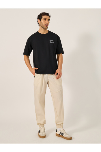 Styli Solid Relaxed Fit Elasticated Cuff Joggers with Contrast Zip detail