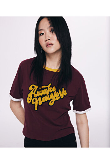 Twist Punch Applique T-Shirt - Stylish and Comfortable Design