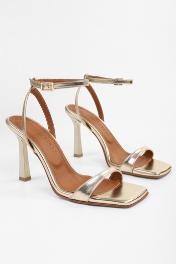 Shoeberry Women's Zerra Gold Patent Leather Single Strap Heeled Shoes
