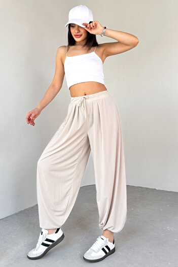 Cappmoda PNT-07413 Παντελόνι Shalwar από ύφασμα Modal Color Stone με λεπτομέρεια στο πόδι
