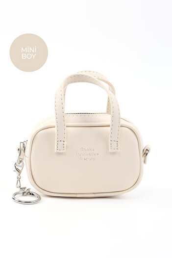 SHAKA Cream Shk210 Faux Leather Single Compartment Zippered Handbag and Charm Bag Accessory