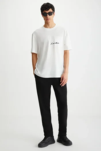 GRIMELANGE HUXLEY Herrenhose mit normaler Schlauchbeine, normaler Schnürung an der Taille, schwarze Hose aus Bio-Baumwolle mit Seitentaschen
