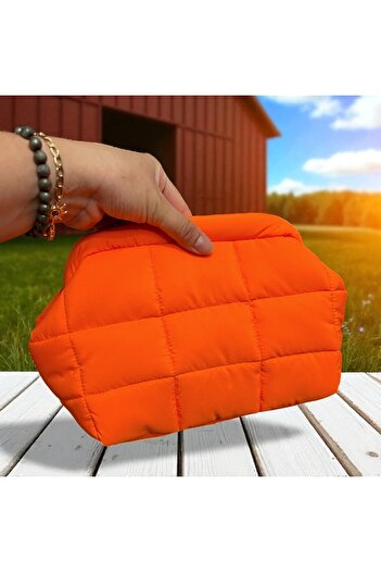 Nuggita Neon Orange Puffer Secret Scholarship Clutch Bag
