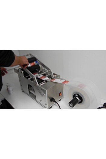 Jobs ahead group Machine for labeling cylindrical containers
