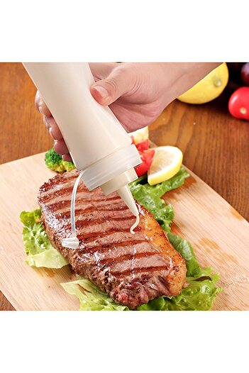 CME Two plastic squeeze bottles for ketchup, mustard, and similar liquids