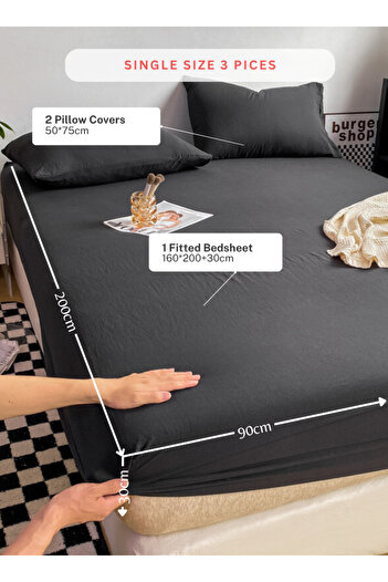 LUNA HOME 3-Piece Set: single-size fitted bedsheet and two pillowcases, washable cotton in a black color.