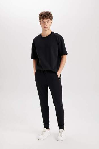DeFacto Jogger Sweatpants Slim Fit Slim Fit με κορδόνια στη μέση Ελαστικό φερμουάρ με τσέπη A4387AX23AU