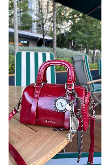 Levidor Burgundy Patent Leather Handbag with Keychain Detail
