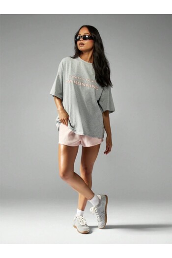 Kaptins Women's T-Shirt with the Message, "I'M Running, I Can'T Write" Printed on It.