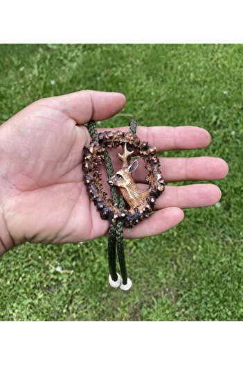Handmade Hand-carved American antler bolo tie with deer motif