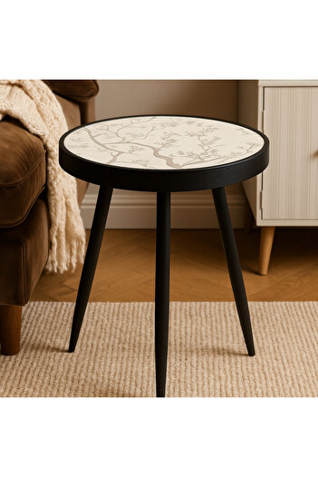 Vi Markets Elegant round tea table with a modern design and sturdy legs.