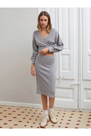 Ruby Gray double-breasted suit with raised skirt