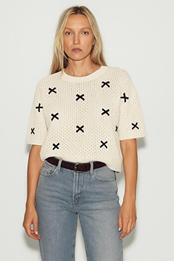 HAKKE Oversize sweater with bow and openwork