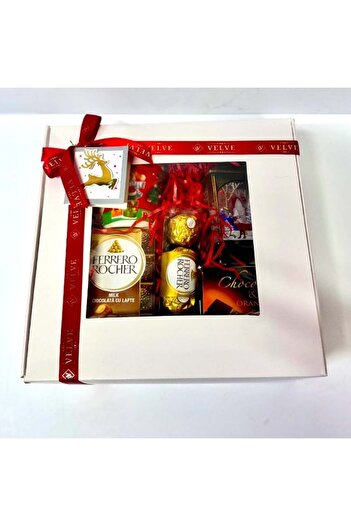 velve Secret Santa package with lantern decoration, scented candle, mug and selection of sweets