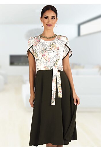 AD Fashion Office dress with floral printed bust on a white background and plain dark khaki pleated skirt, accessorized with c
