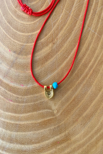 Shepidi Blue Bead Necklace with Red String and Gold Figure