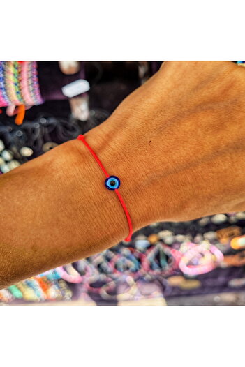 Wild Bracelets Adult flat evil eye bracelet, adjustable from red silk cord