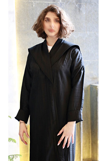 outline Black abaya with a distinctive collar