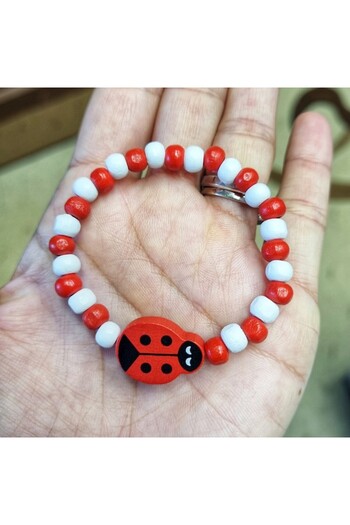 Wild Bracelets Children's bracelet with elastic Ladybug charm, with wooden beads