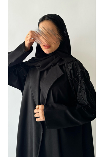outline Black abaya embroidered with beadwork