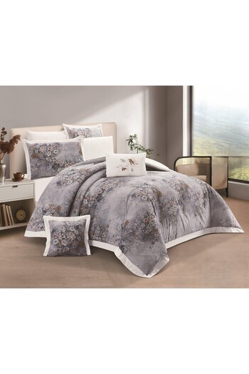 SNOOZYL A king-size bed sheet with a floral design and a cotton filling to add elegance and beauty.