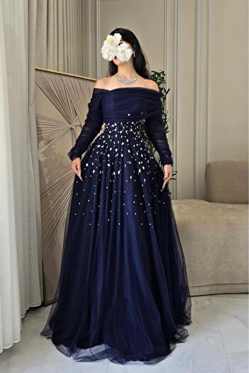 Al Jawhara Off-shoulder evening dress decorated with crystals in several colors