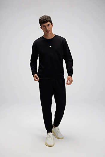 Ellesse Βαμβακερό παντελόνι με κανονική εφαρμογή και κανονική μέση με ριμπάνι στο πόδι Ανδρικό παντελόνι EM554