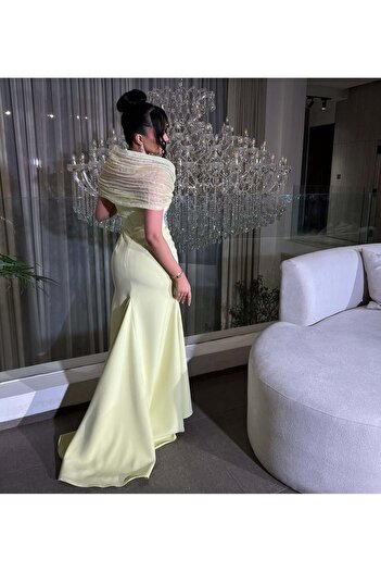 FAYD AL-JAWRI Long Barbie yellow evening dress with hand embroidery and ruffled shoulder