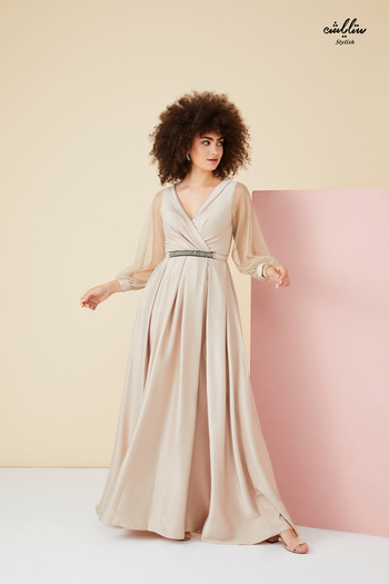 Stylish Elegant beige dress with tulle sleeves and an elegant belt embellished with crystals
