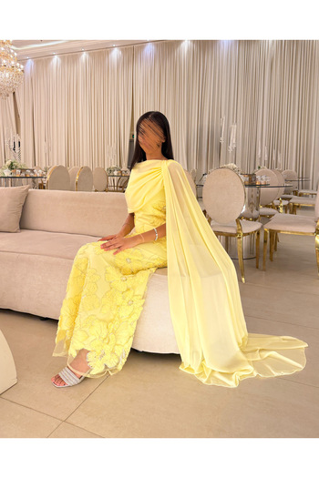 Generic Yellow evening dress embroidered with flowers and an elegant side shawl