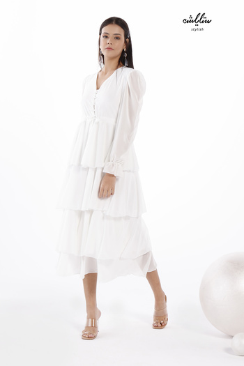 Stylish White maxi dress with a layered cut for a soft, feminine look.