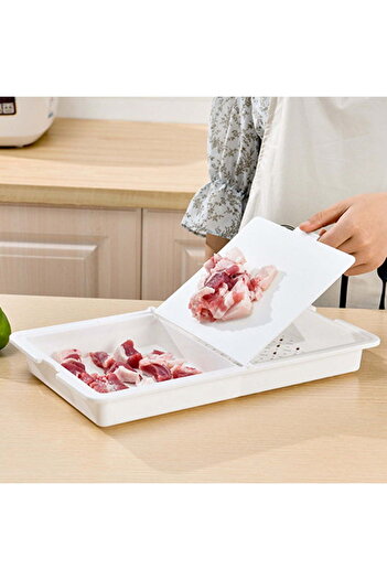Generic A cutting board featuring an innovative design that combines a cutting board and a strainer basket to make washing and draining vegetables and fruits easy.