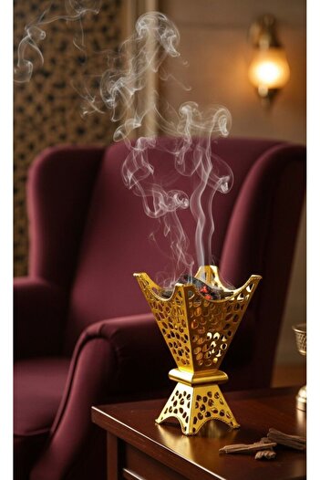 Generic Luxury golden incense burner with an elegant and modern design