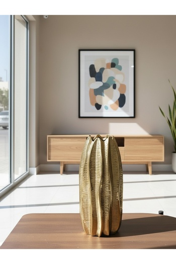 Generic A shiny gold rose vase - a sophisticated decorative piece that fits any space. Comes without the roses.