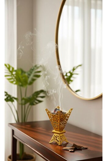 Generic Luxury golden incense burner with an elegant and modern design