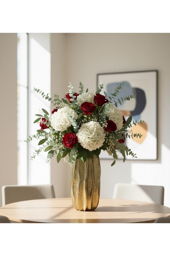Generic A shiny gold rose vase - a sophisticated decorative piece that fits any space. Comes without the roses.