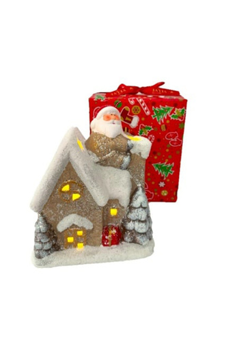 velve Santa's fairy tale house, bright Christmas decoration in the shape of a snow-covered house