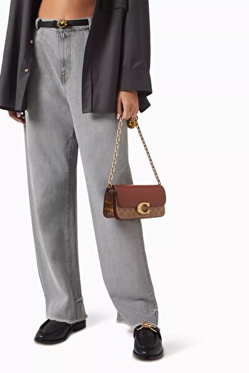 Noname Luxury women's bag similar to the Coach brand, with an elegant design and a gold chain