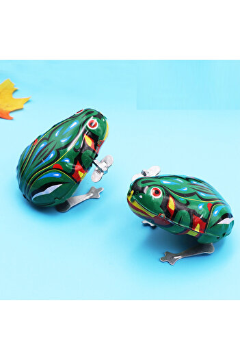 Choice 1PCS random This is a classic spring jumping iron frog children's toy, action doll children's toy, a